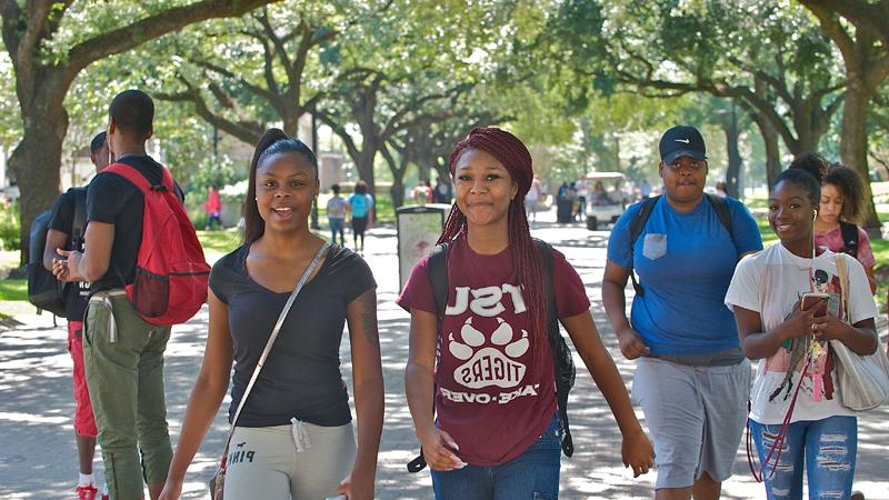 Walking two female students on campus